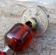 アンブロイド・古銭・両剣水晶・オールドビーズのストラップ・タイの古銭とアンブロイド